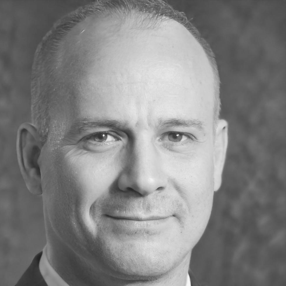 Kieran Walsh financial analyst portrait